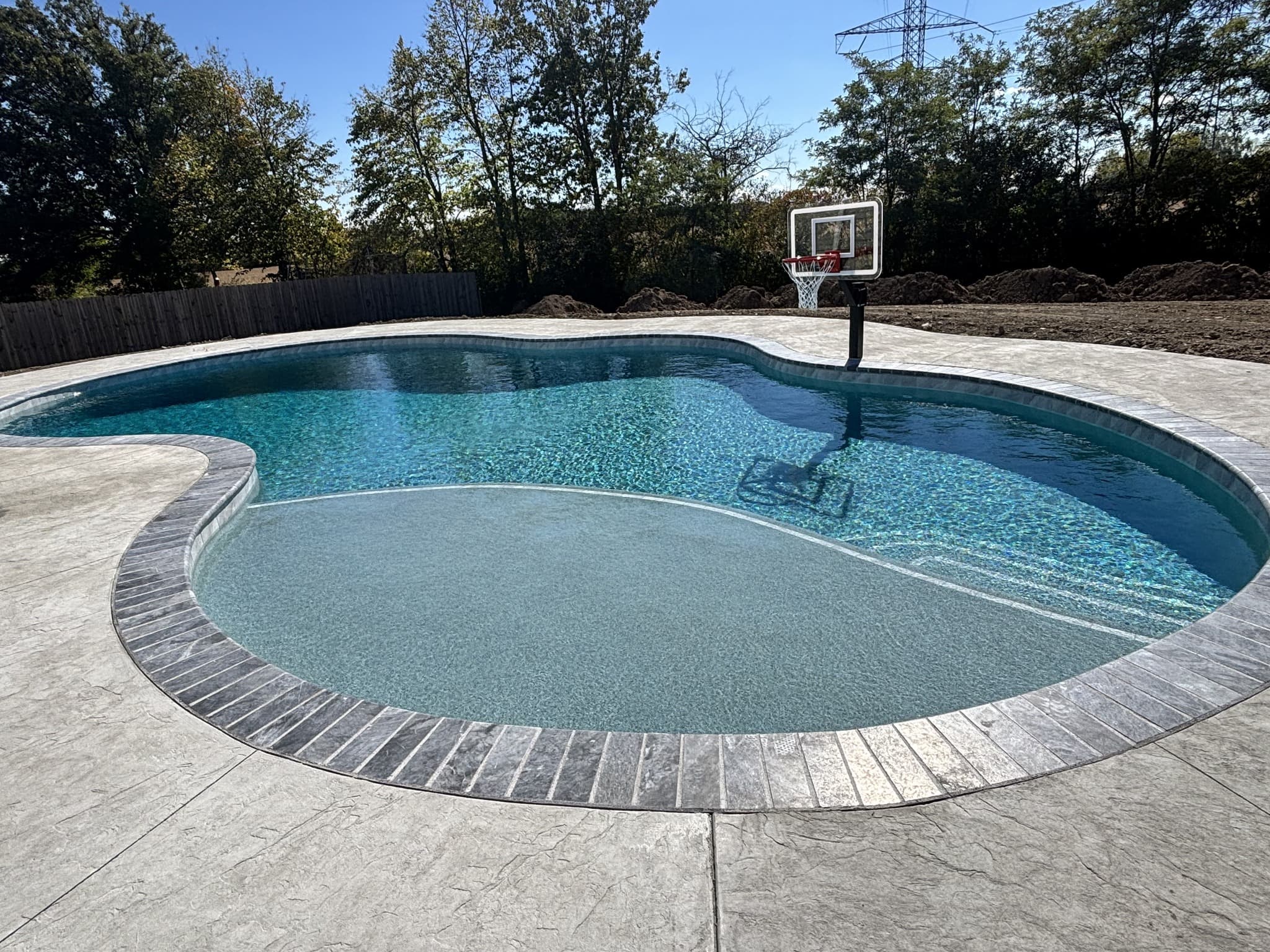 Rock-Solid Artistry: The 100-Ton Foundation of a Perfect Pool Deck