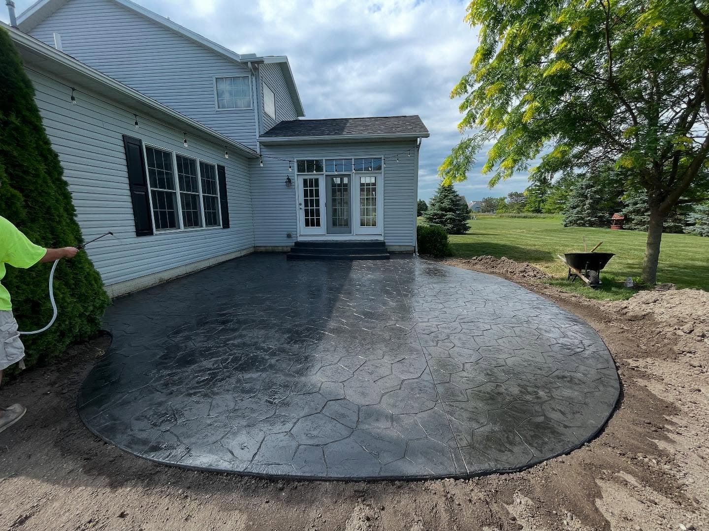 Modern Statement: Bold Black Stamped Concrete Patio